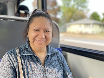 Middle-aged woman on a Metro Transit bus