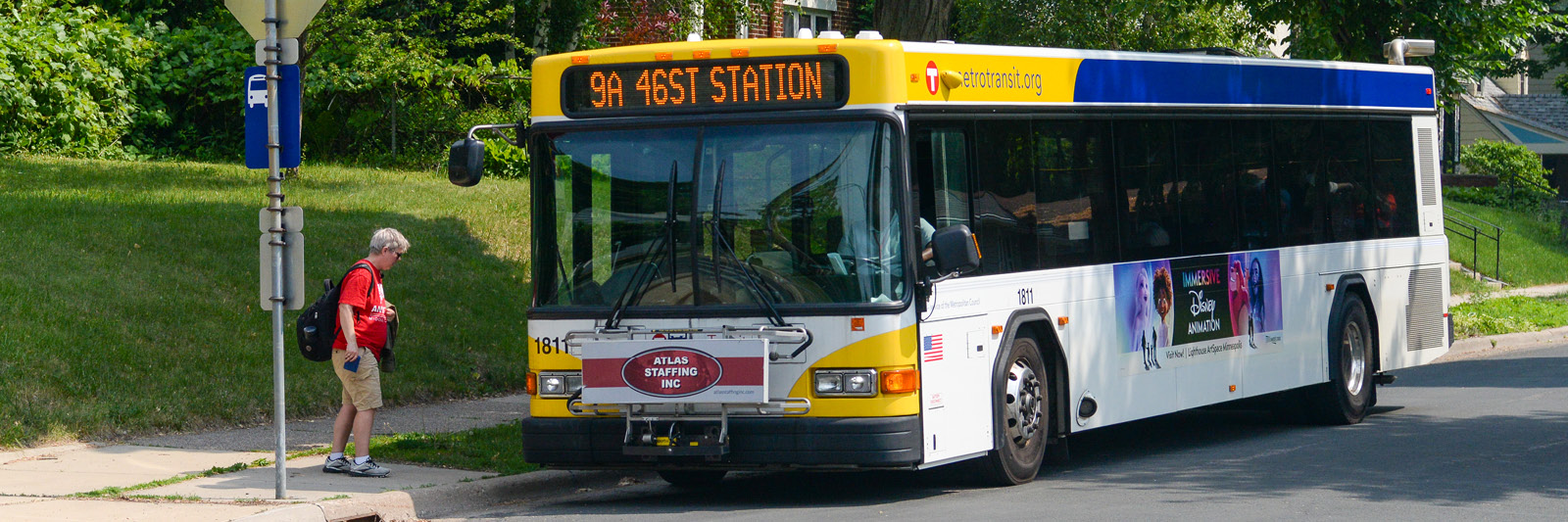 Staff member getting on a Metro Transit bus