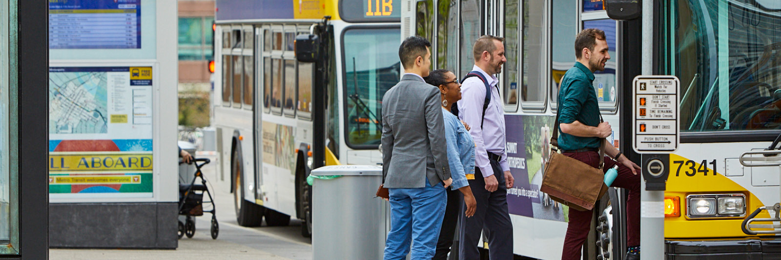 Employees getting onto a Metro Transit bus