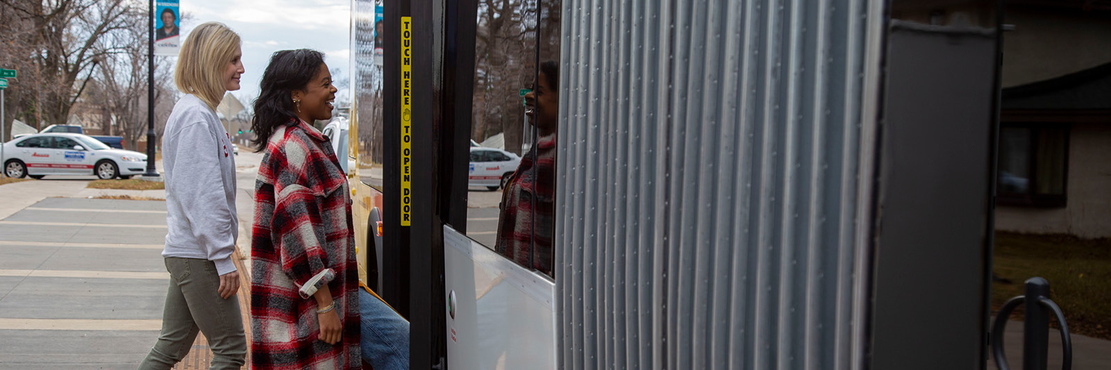 Students getting on a Metro Transit bus