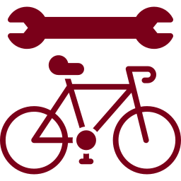 An icon of a bicycle with a wrench above it