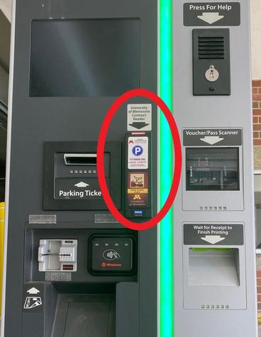 Photo of parking pay station with the contract reader circled in red